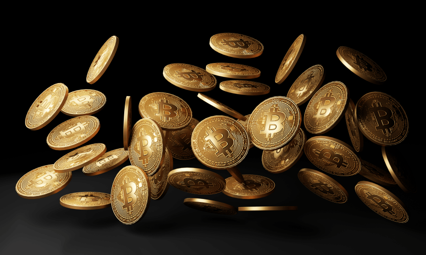 Golden bitcoins drop in black background